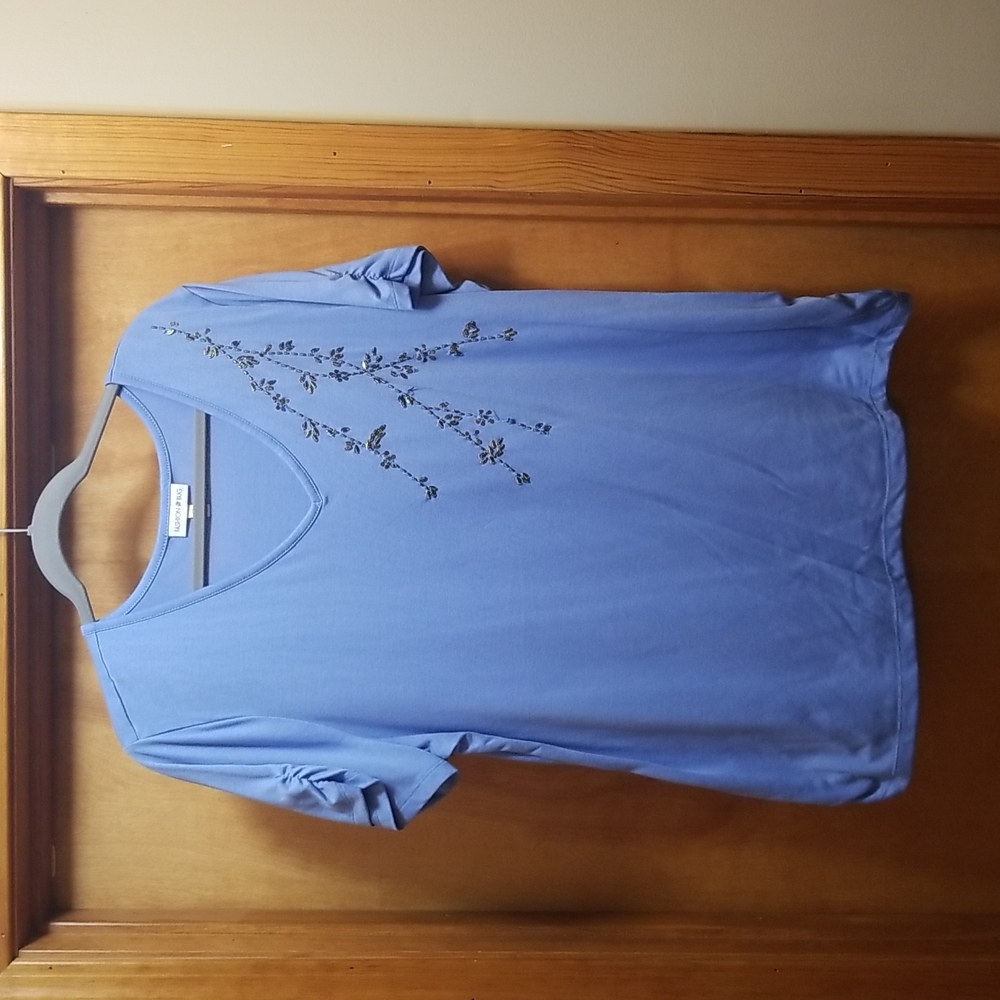 Periwinkle tinix with ryched sleeves and bottom ruching and copper decor on fron